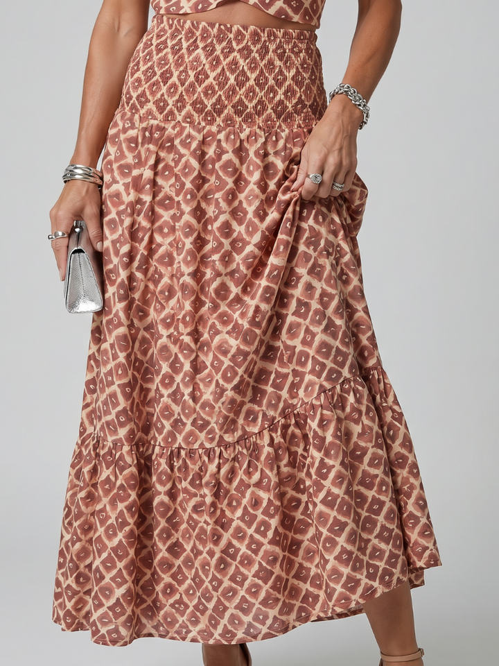 Amira | Vestido midi com estampado geométrico e alças cruzadas